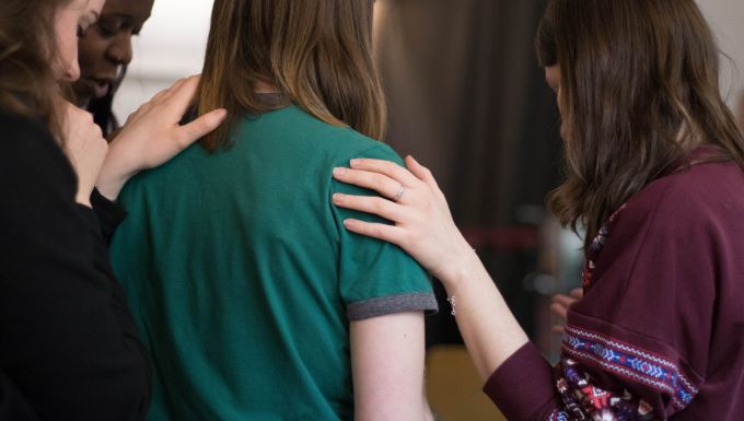 Girls showing empathy to their colleague